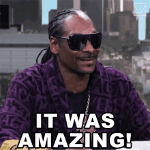 snoop dogg wearing sunglasses and a purple robe says  it was amazing 